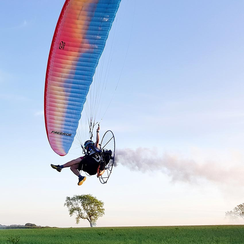 Paramotor pilot in flight